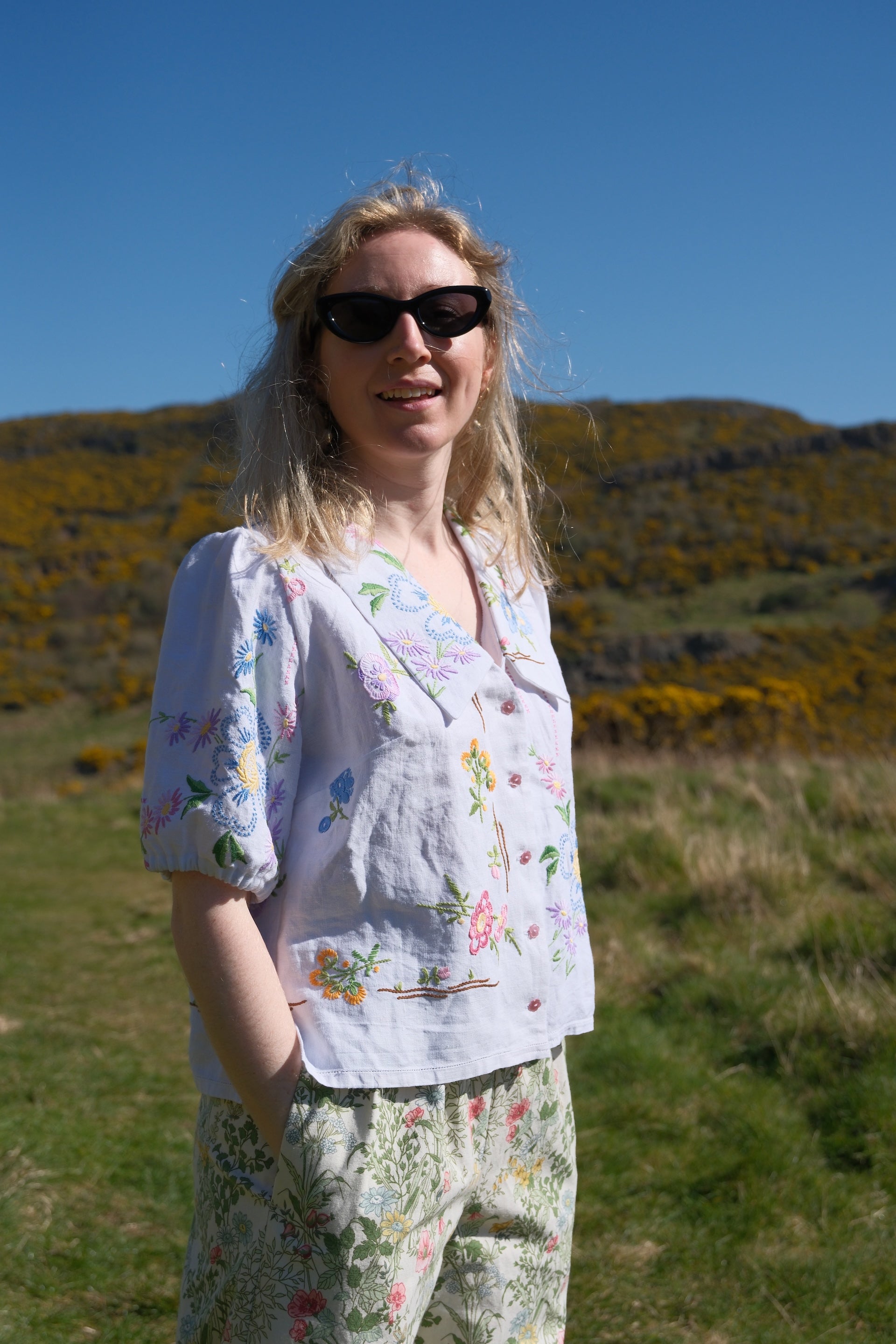 model wears unique slow fashion blouse made from two 1940's tablecloth by sustainable fashion designer jen byrne