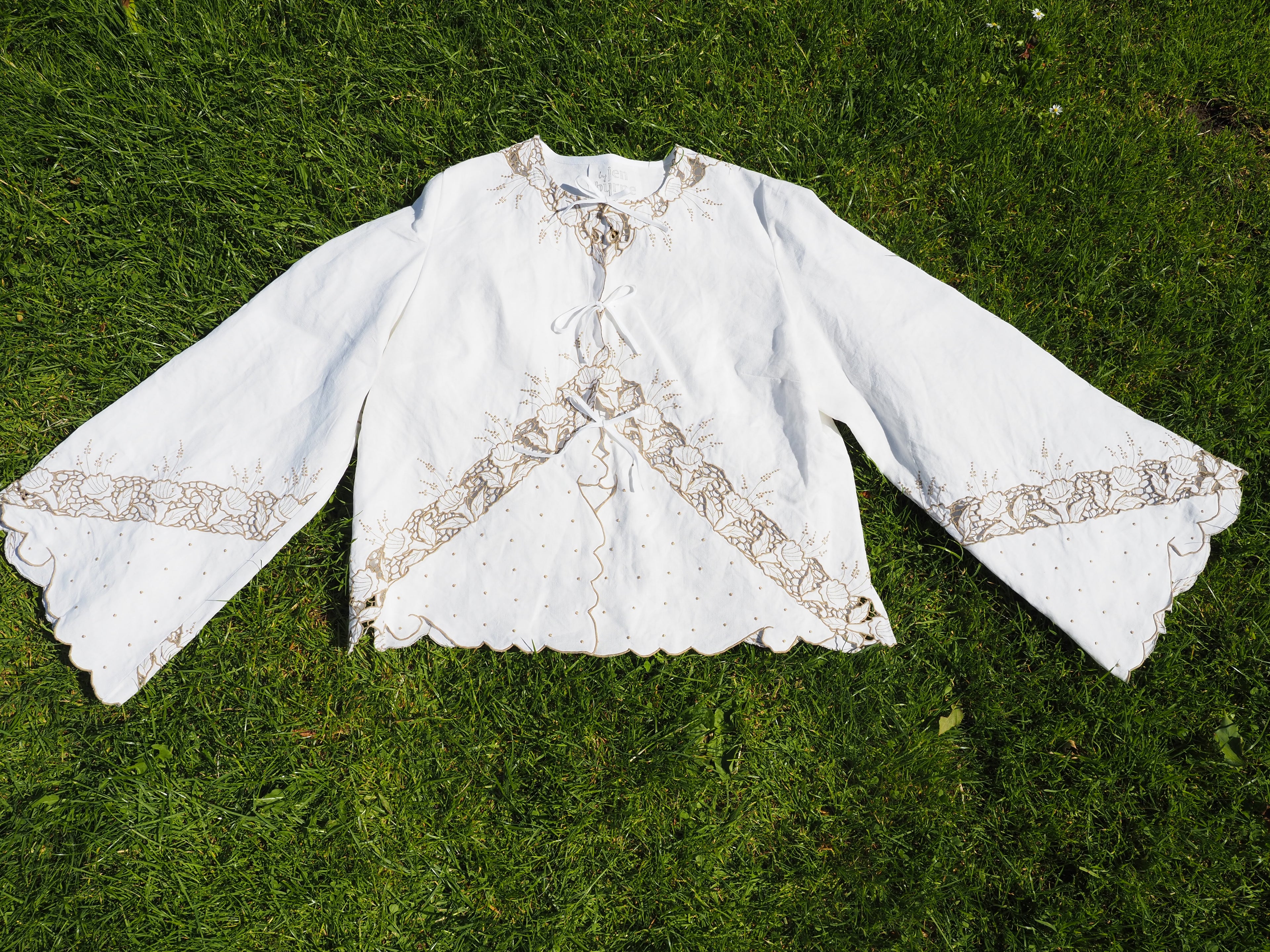 White lace blouse on green grass